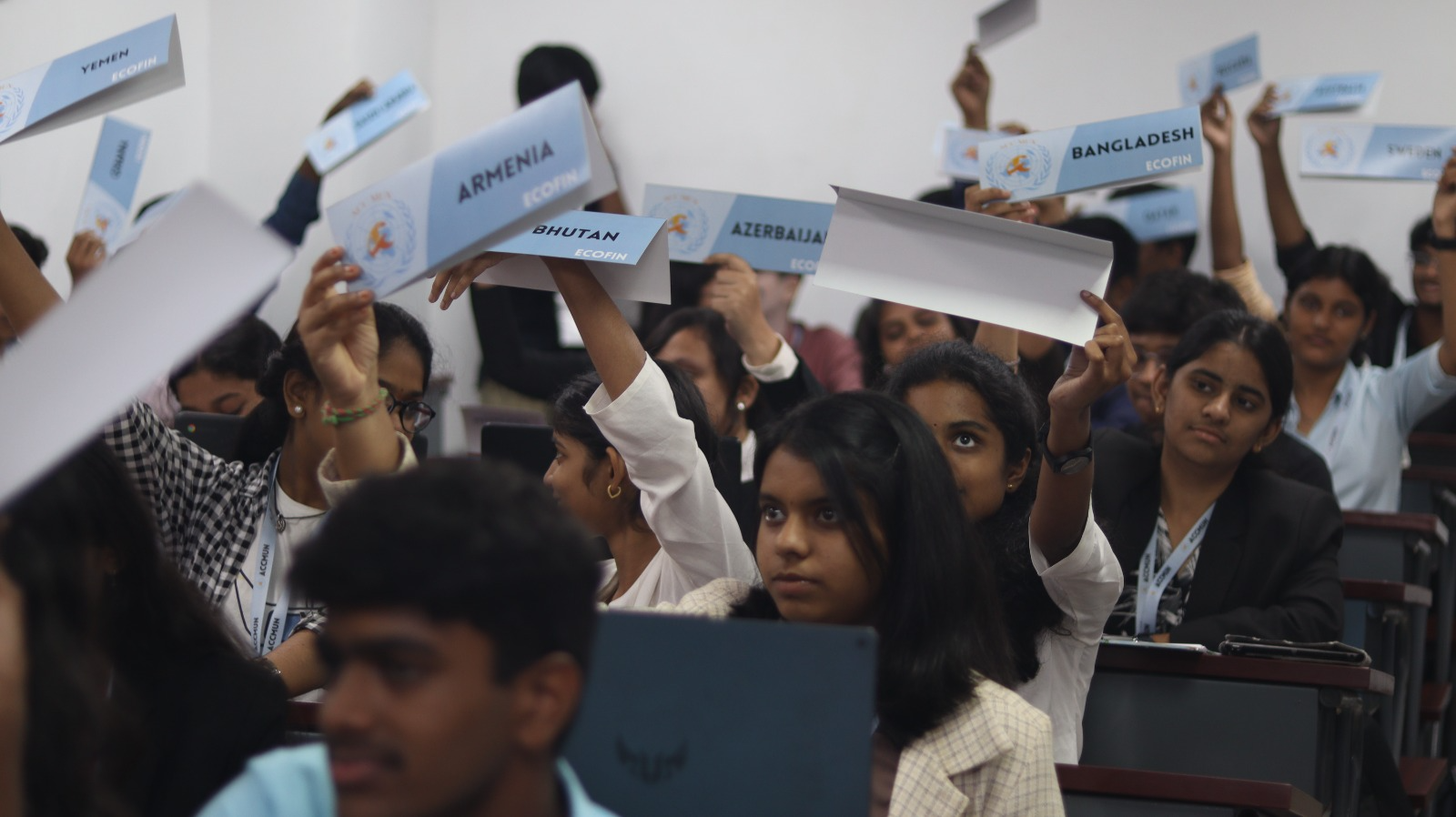 ACCMUN 3.0 delegates raising placards